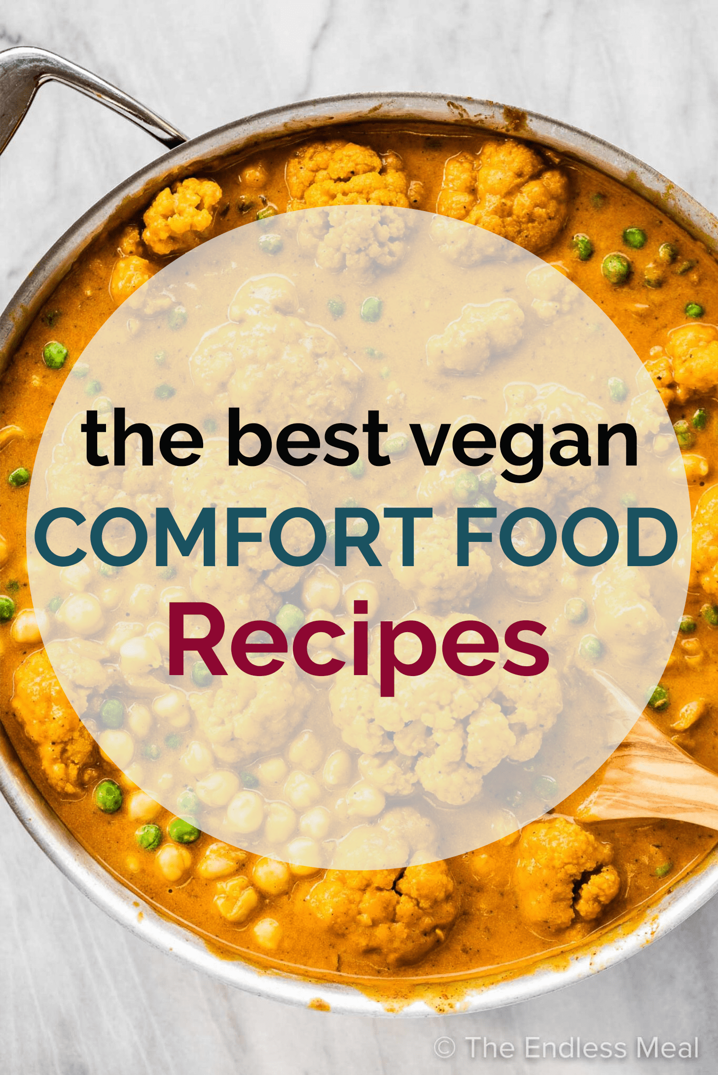 A bowl of cauliflower curry soup with a transparent circle on top with the words vegan comfort food recipes on top.