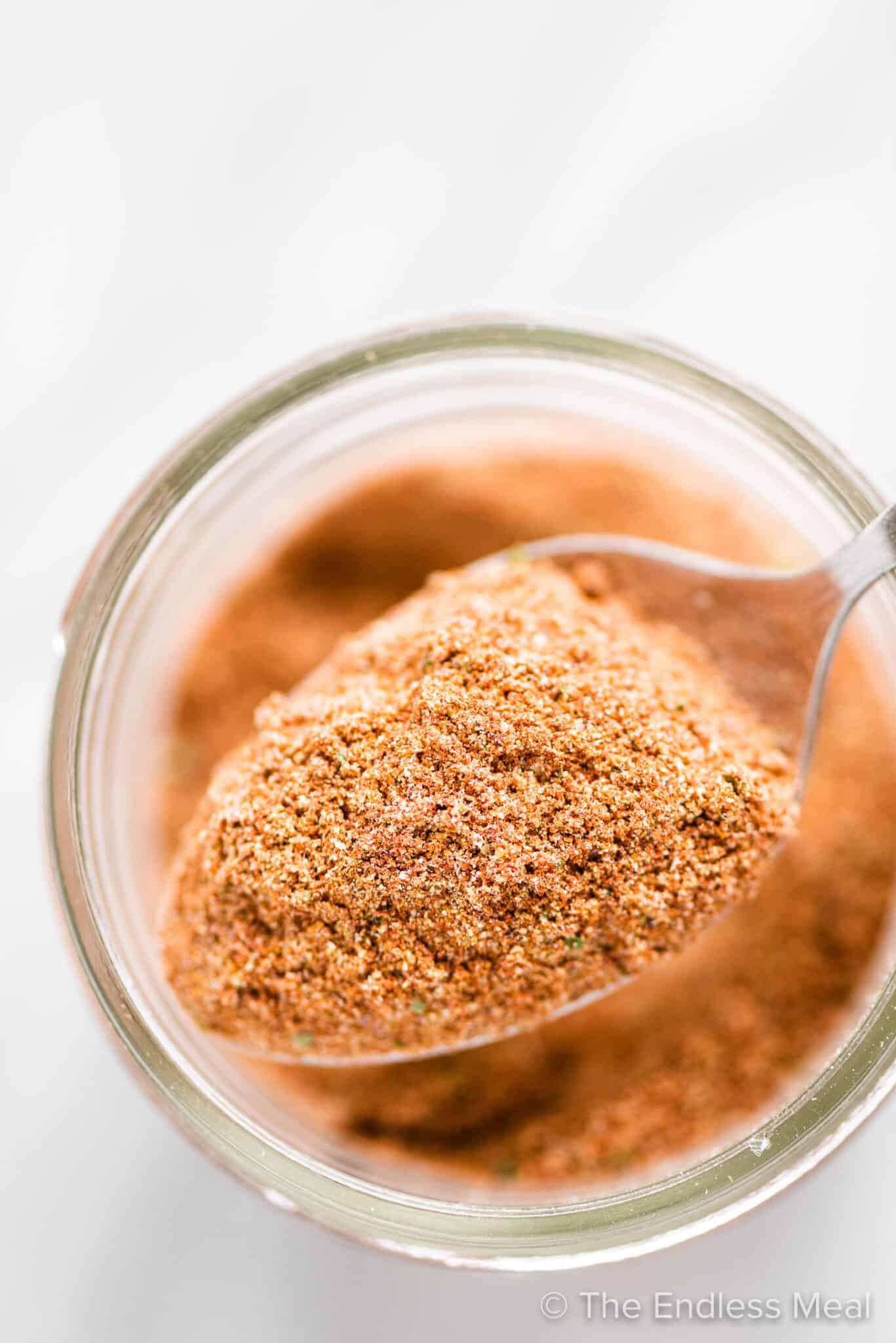 Looking down on a spoonful of homemade taco seasoning.