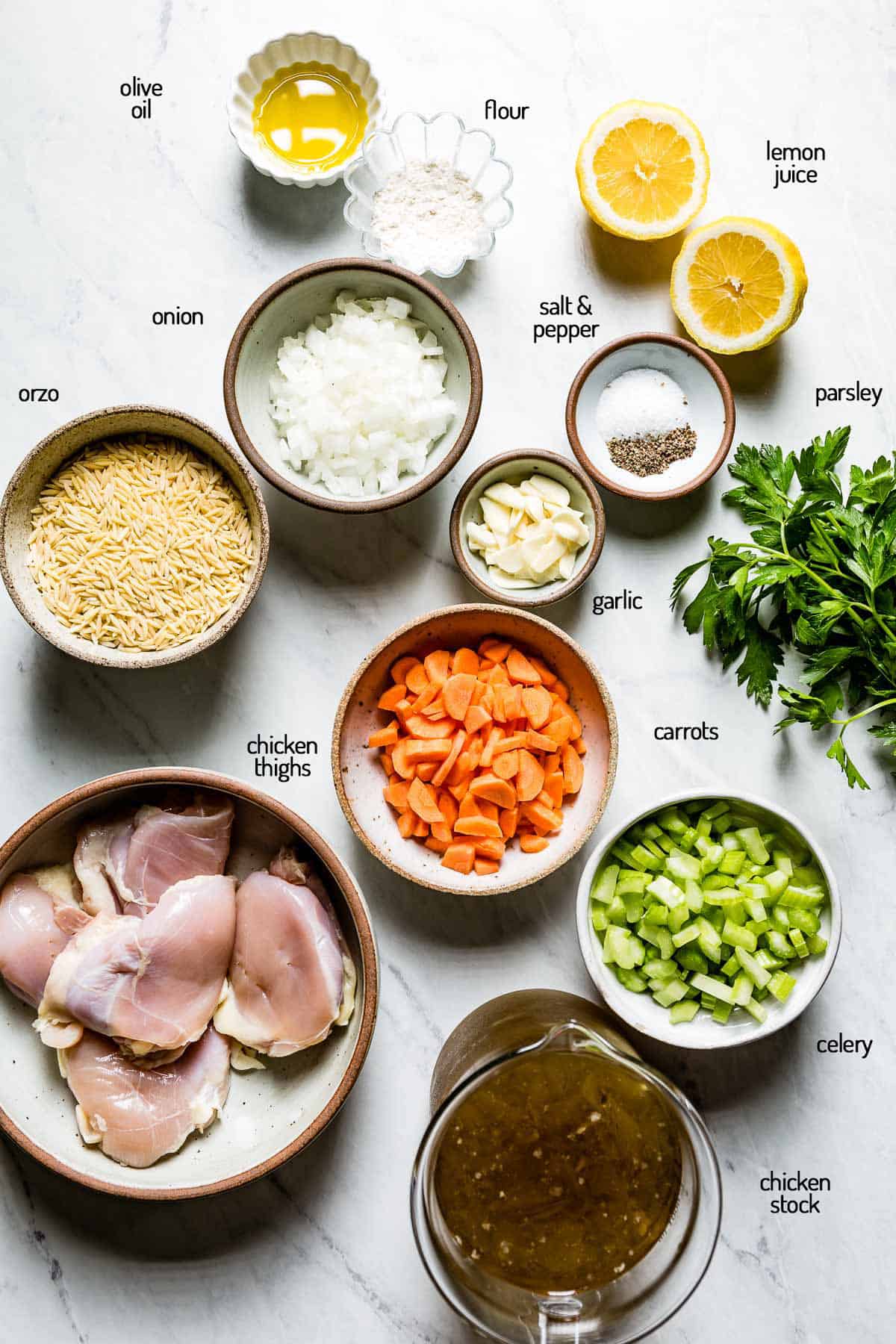 Ingredients for the recipe are laid out on a white backdrop