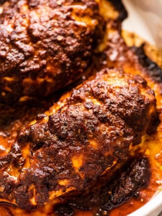 Spicy Chicken Marinade on chicken breasts in a baking dish.
