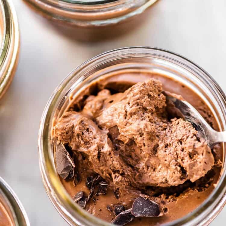 A spoon scooping some soft vegan pots de creme.