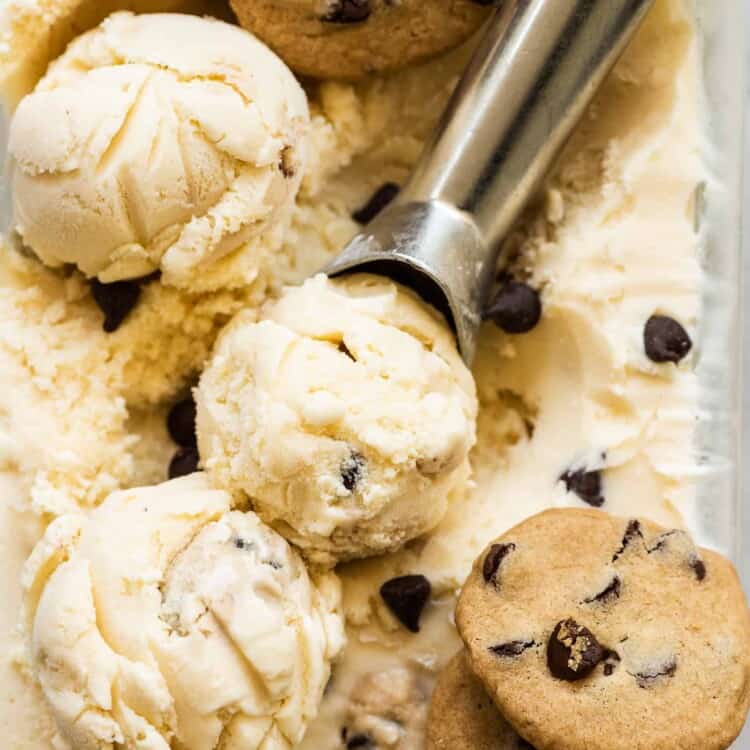 Chocolate Chips Cookie Dough Ice Cream with an ice cream scoop and three cookies.