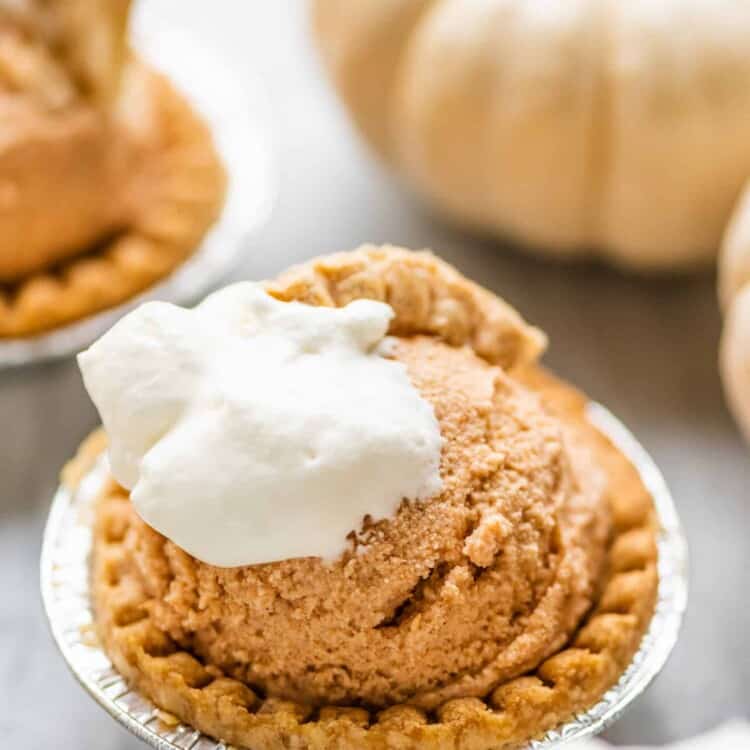 Pumpkin Pie Ice Cream in tart shells with white pumpkins in the background.