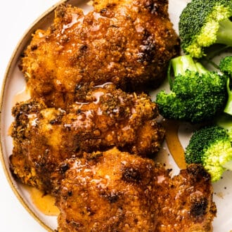 Hot Honey Chicken on a plate with broccoli.