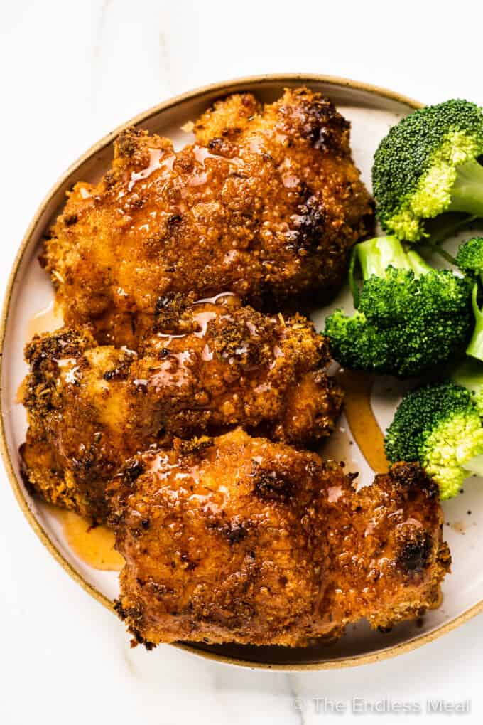 Hot Honey Chicken on a plate with broccoli.