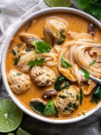 Thai Inspired Chicken Meatball Soup in a bowl with rice noodles.
