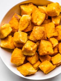A close up of Cheese Bread Bites in a bowl.