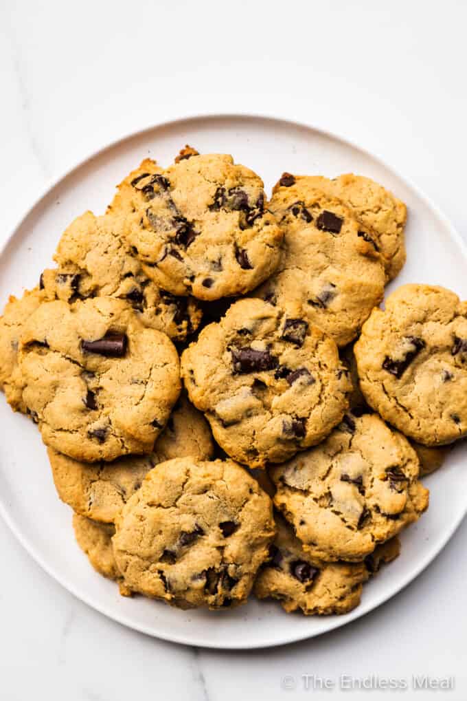 A white plate piled high with miso chocolate chip cookies.