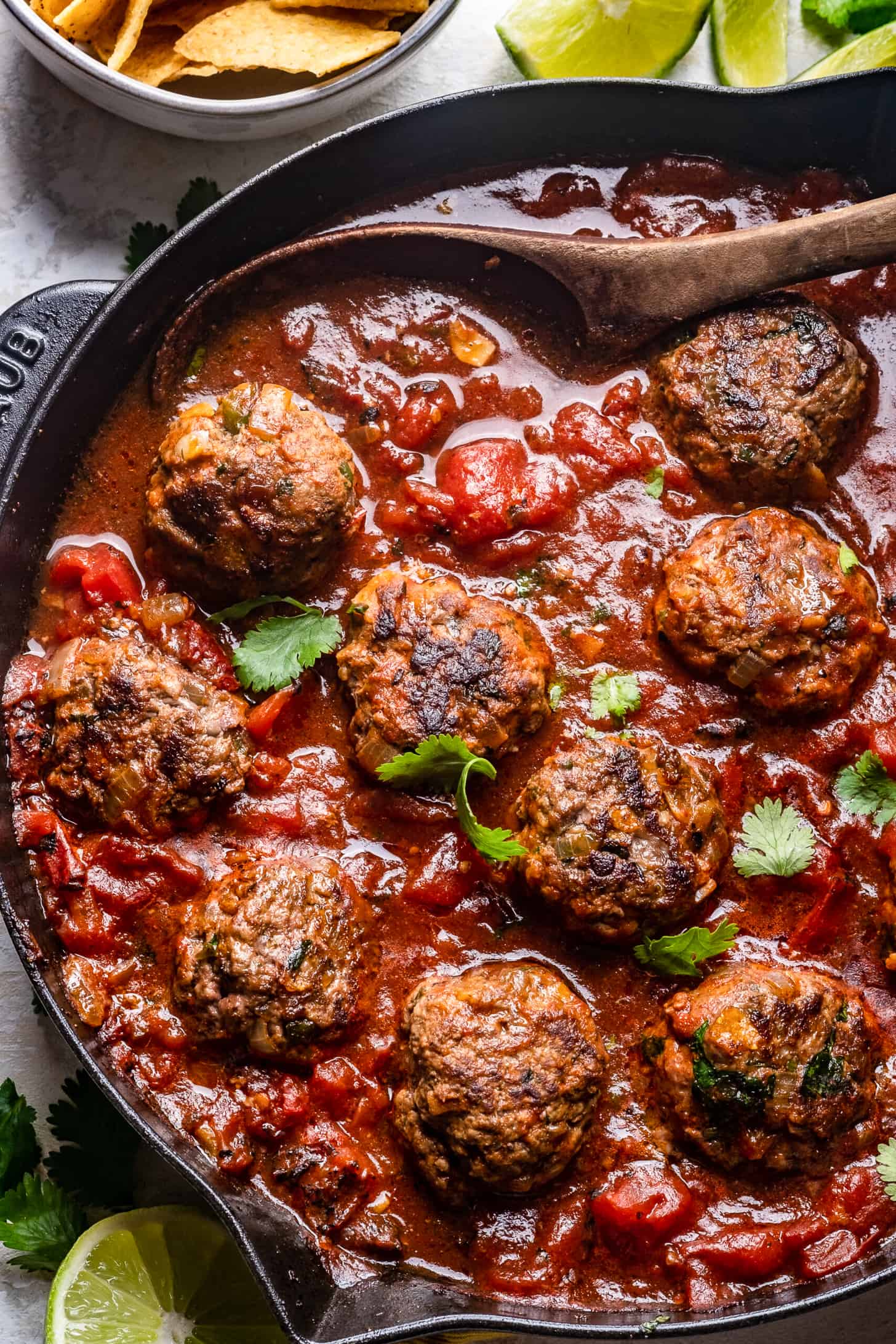 Tex-Mex Meatballs in a tomato sauce in a skillet.