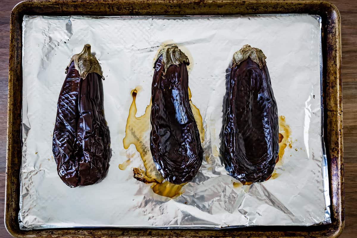 roasted eggplants on a baking sheet.