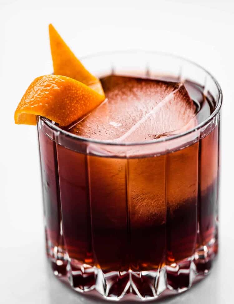 A Coffee Negroni in a rocks glass with an orange peel.