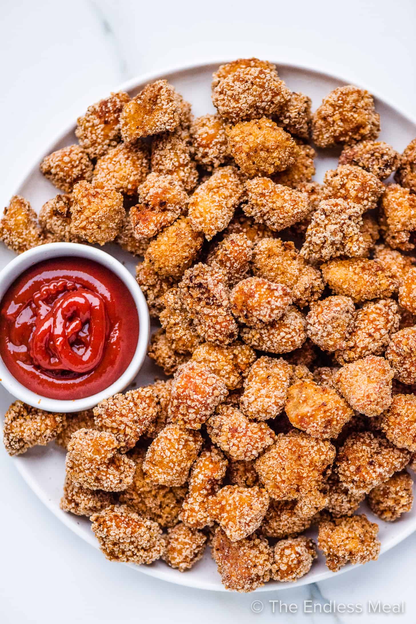 Fried Chicken Bites on a serving platter with ketchup.