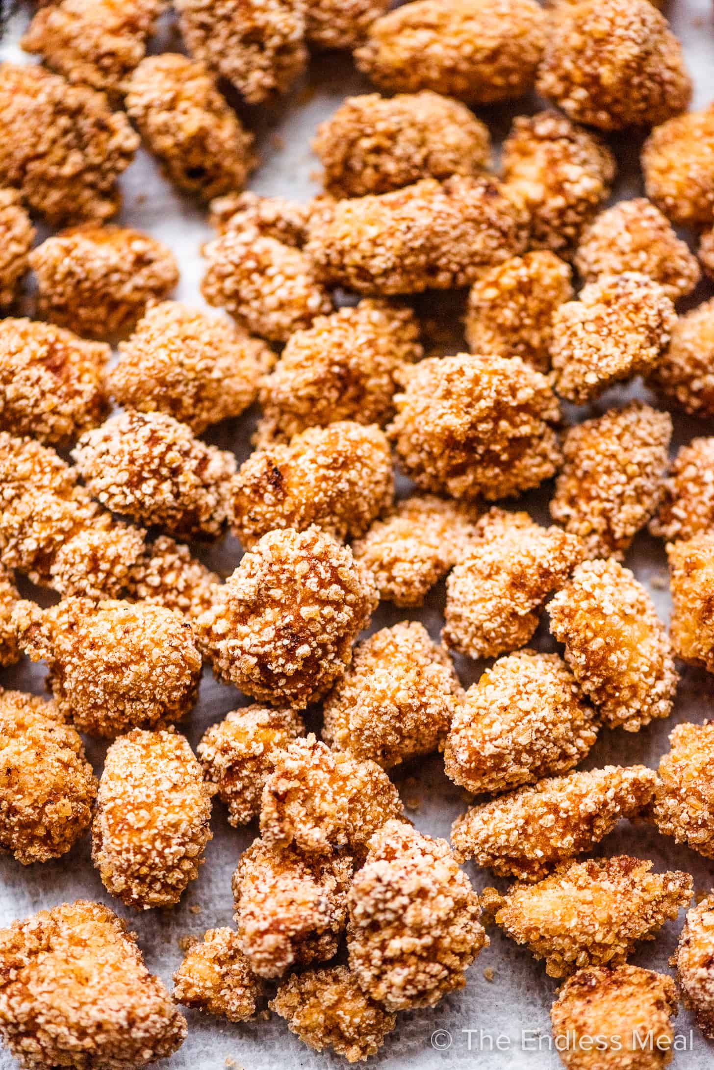 A close up of Fried Chicken Bites on a baking sheet.