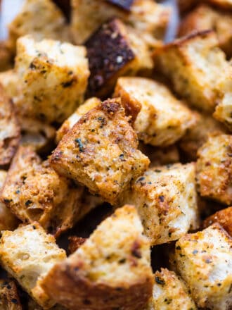 a close up of garlic parmesan croutons in a pile.