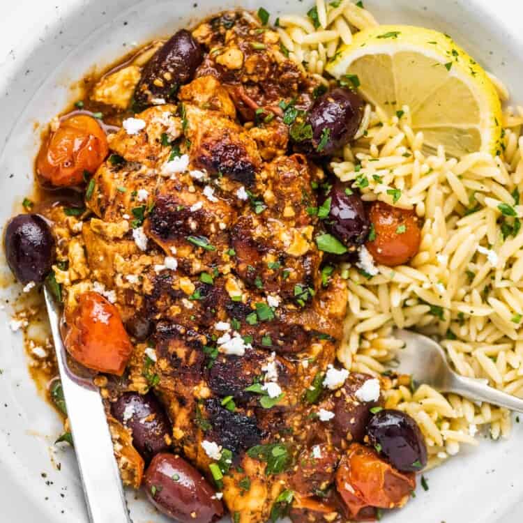 This Greek Chicken Skillet dinner served on a plate with orzo.
