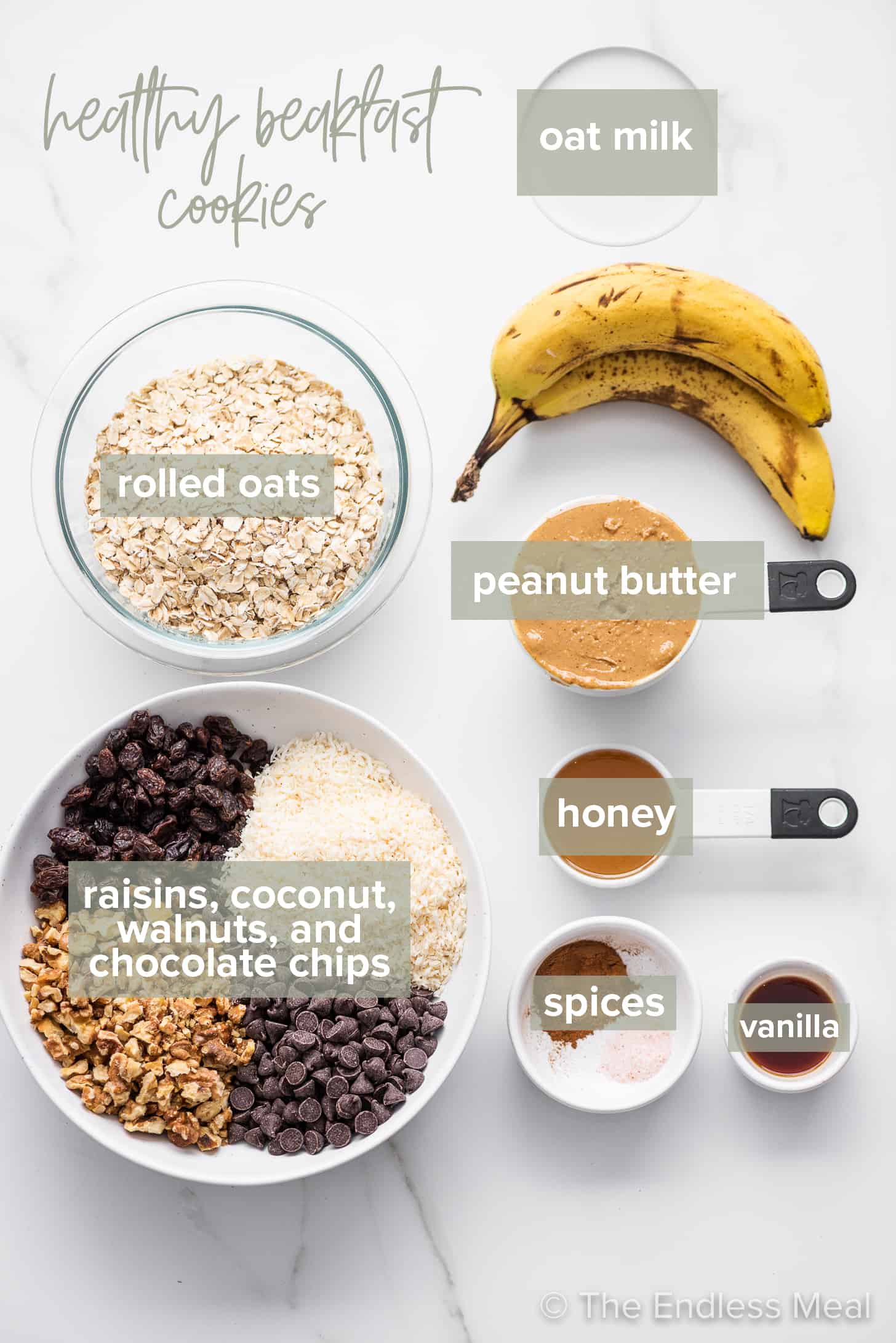 the ingredients to make healthy breakfast cookies on a marble countertop