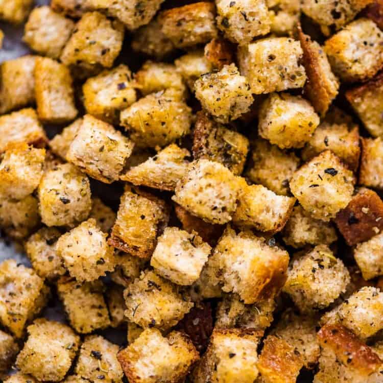 a close of of mini croutons on a baking sheet