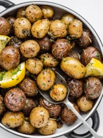 A close up of mini roasted potatoes in a serving dish