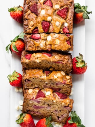 Looking down on a loaf of strawberry banana bread with white chocolate chips.