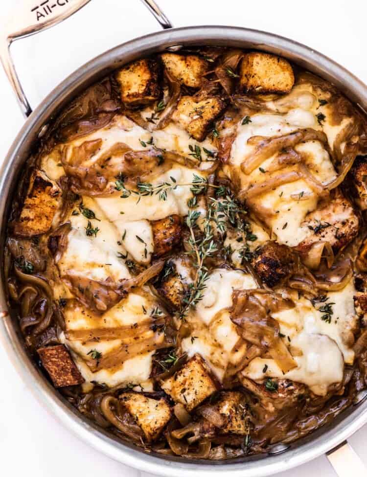 a pan of smothered french onion soup pork chops