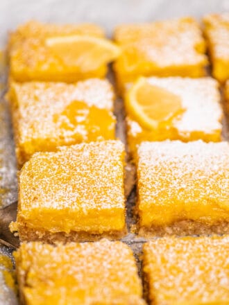 a close up of lemon bars on a pan.