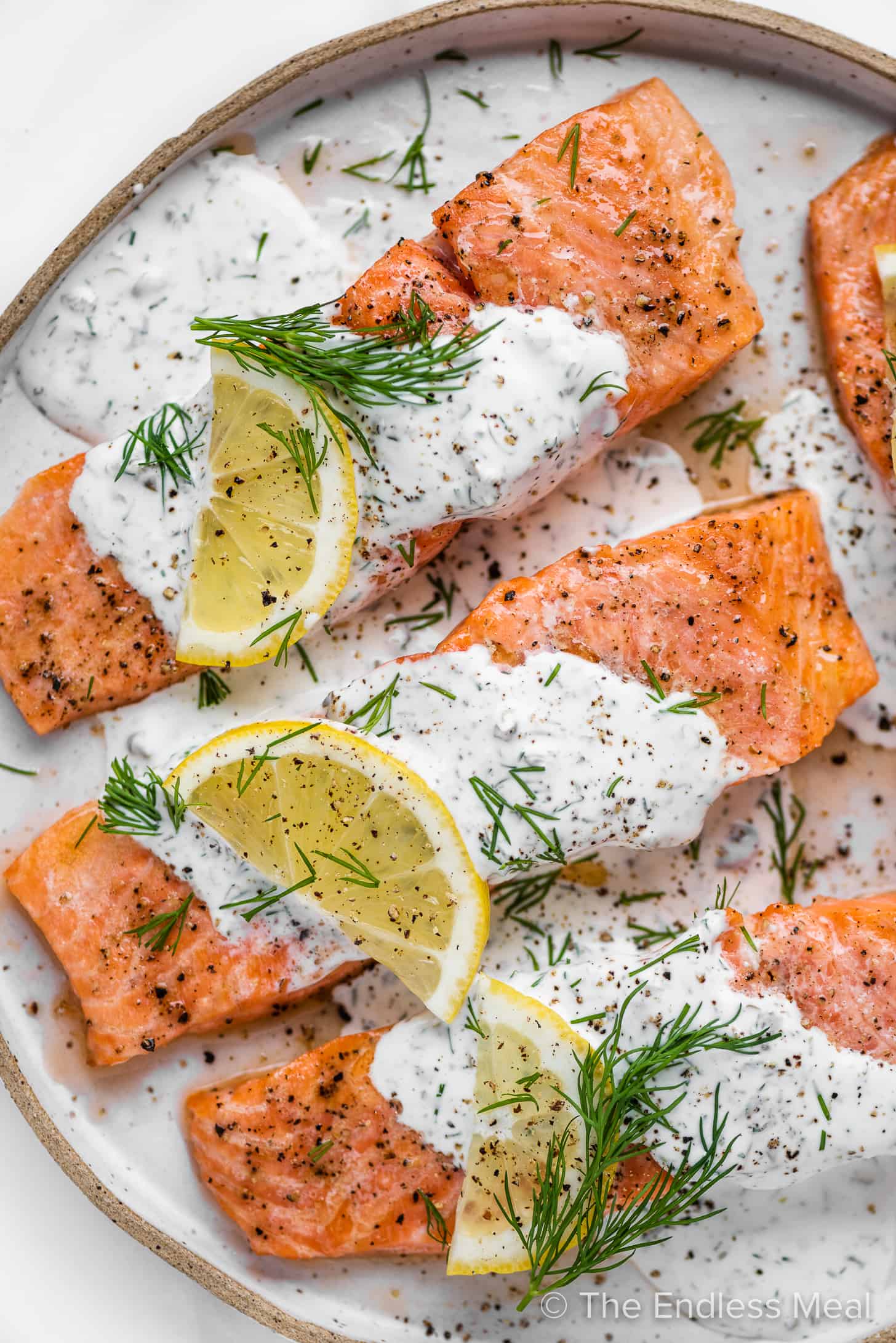 4 pieces of tender salmon with creamy lemon dill sauce