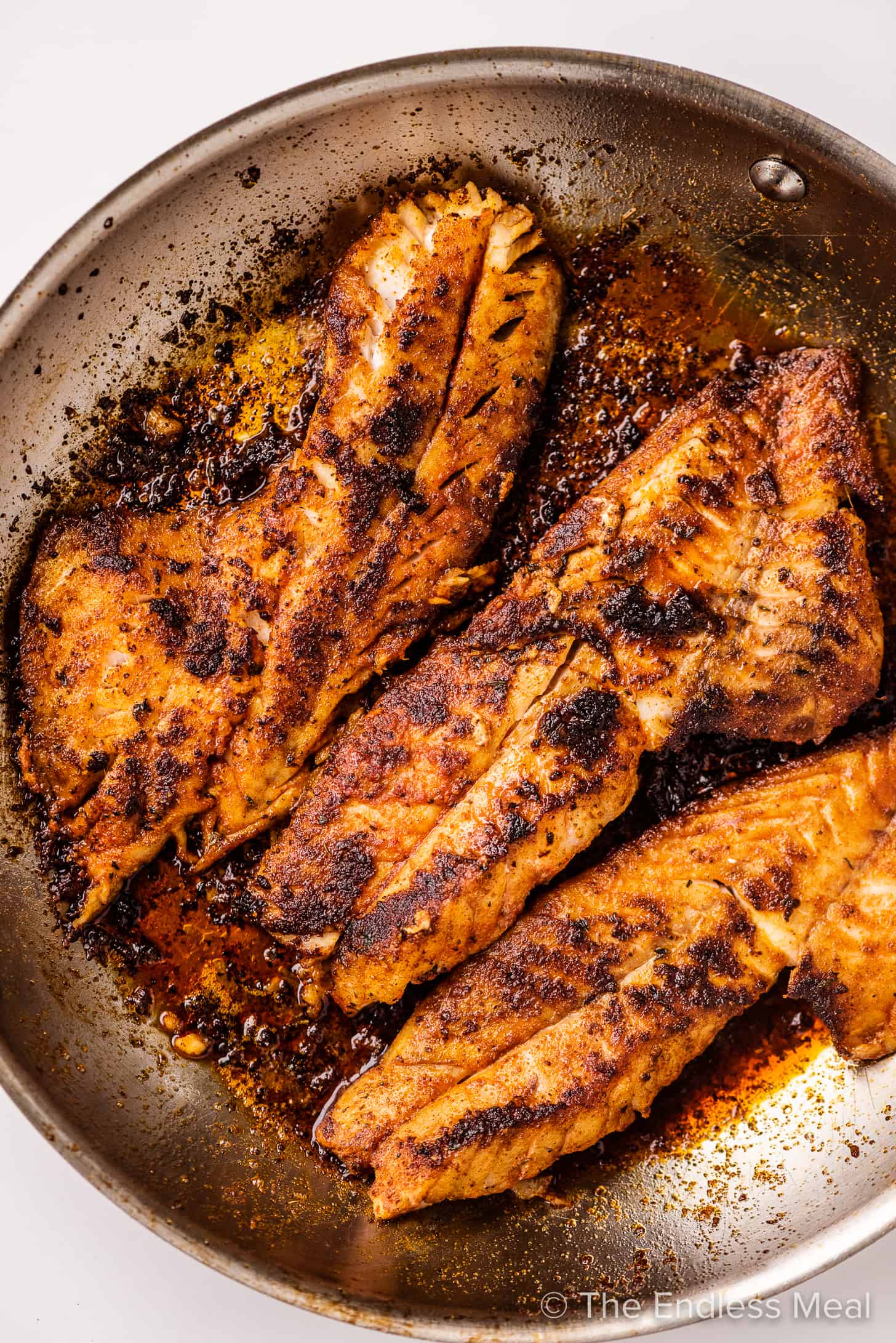 blackened rockfish in a pan for tacos