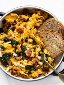chorizo scrambled eggs in a serving dish with toast