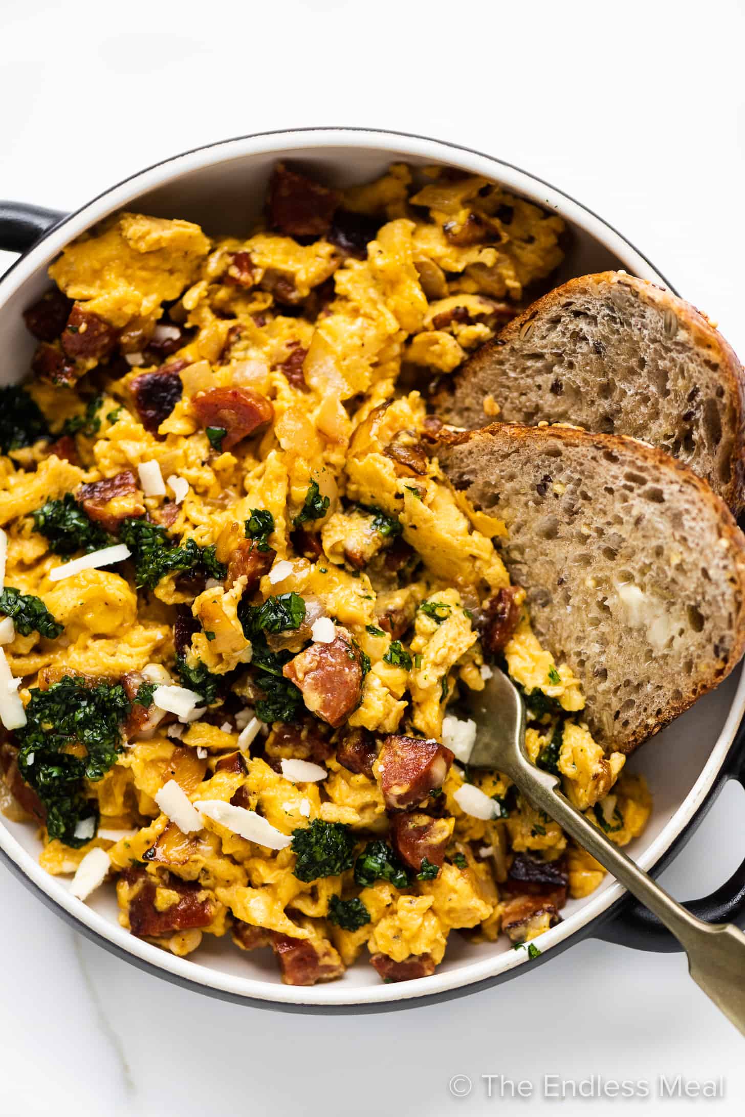 chorizo scrambled eggs in a serving dish with toast