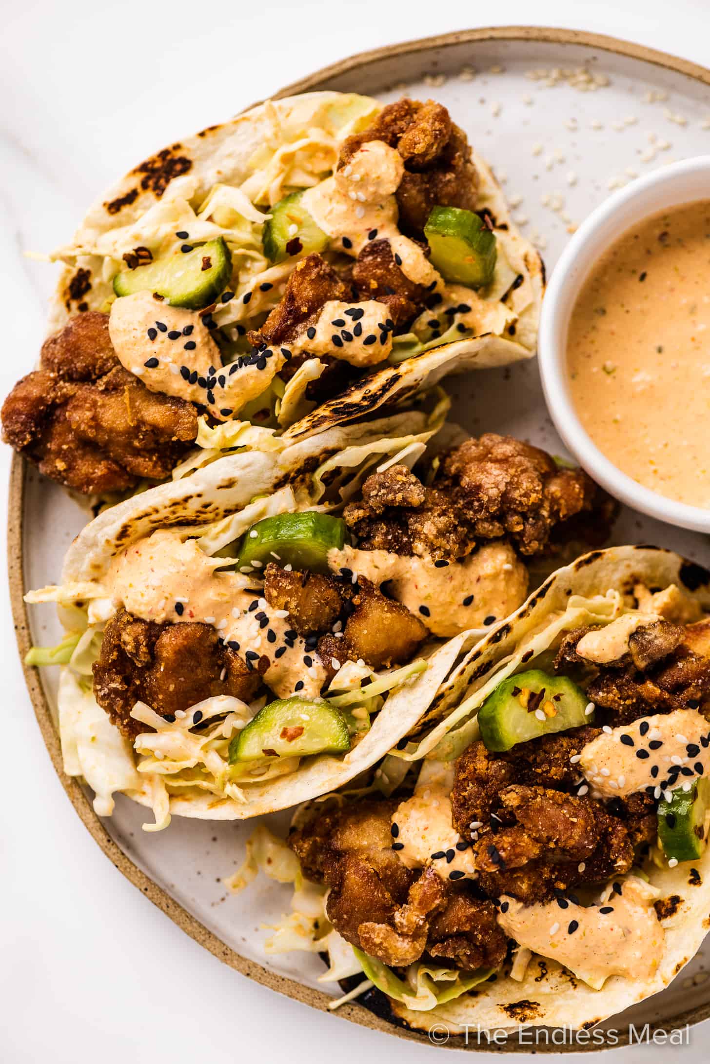tacos filled with karaage chicken topped with kimchi mayo