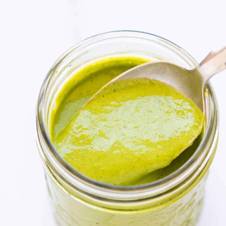 green goddess salad dressing with a spoon.