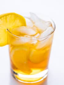 Maple Syrup Lemonade in a glass with a lemon slice