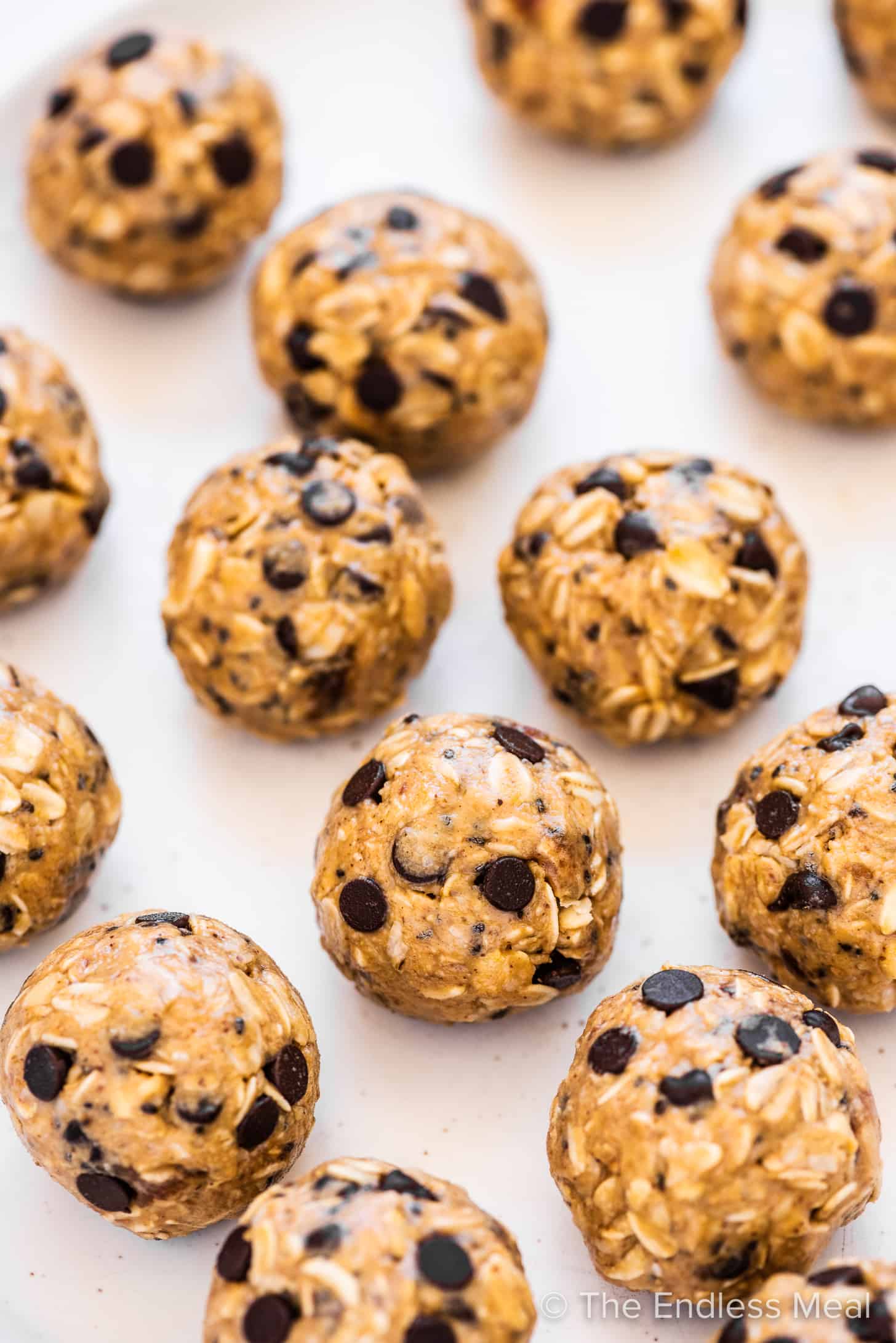 lots of peanut butter energy balls with chocolate chips