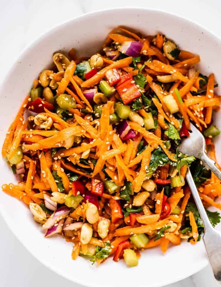 Asian carrot salad in a white bowl