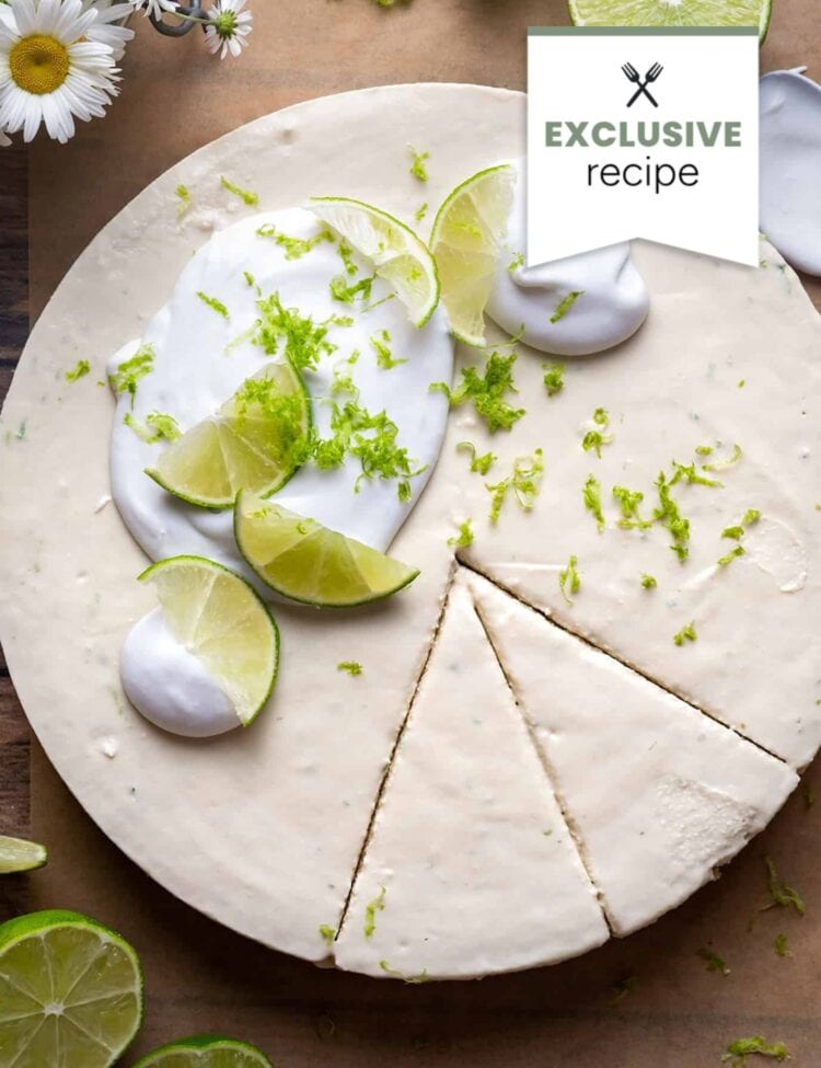 A round, creamy pie garnished with whipped topping, lime slices, lime zest, and a hint of blackberry lemonade flavor; three slices are cut. A label reads EXCLUSIVE recipe.