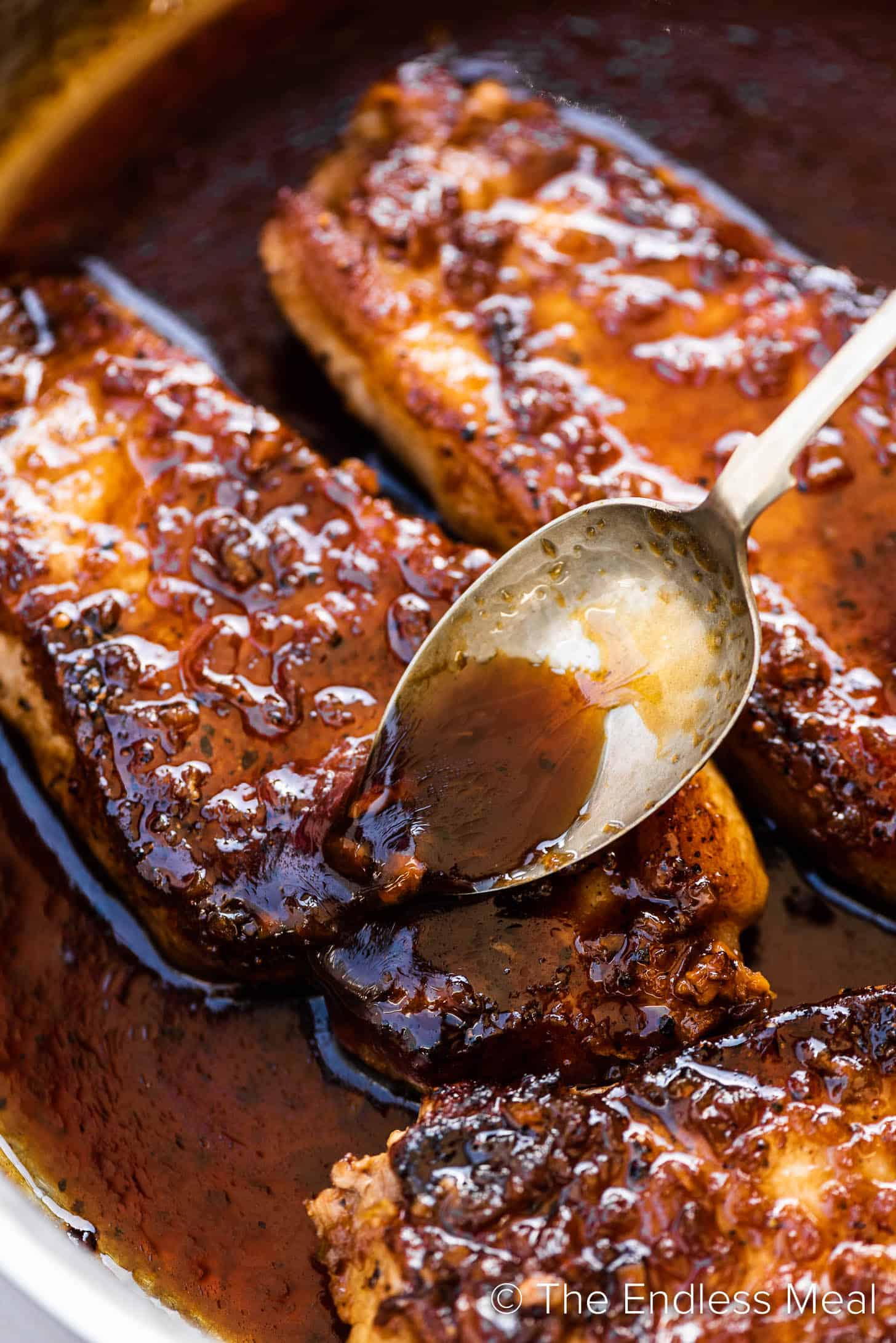 A close-up of Honey Garlic Pork Chops in a pan