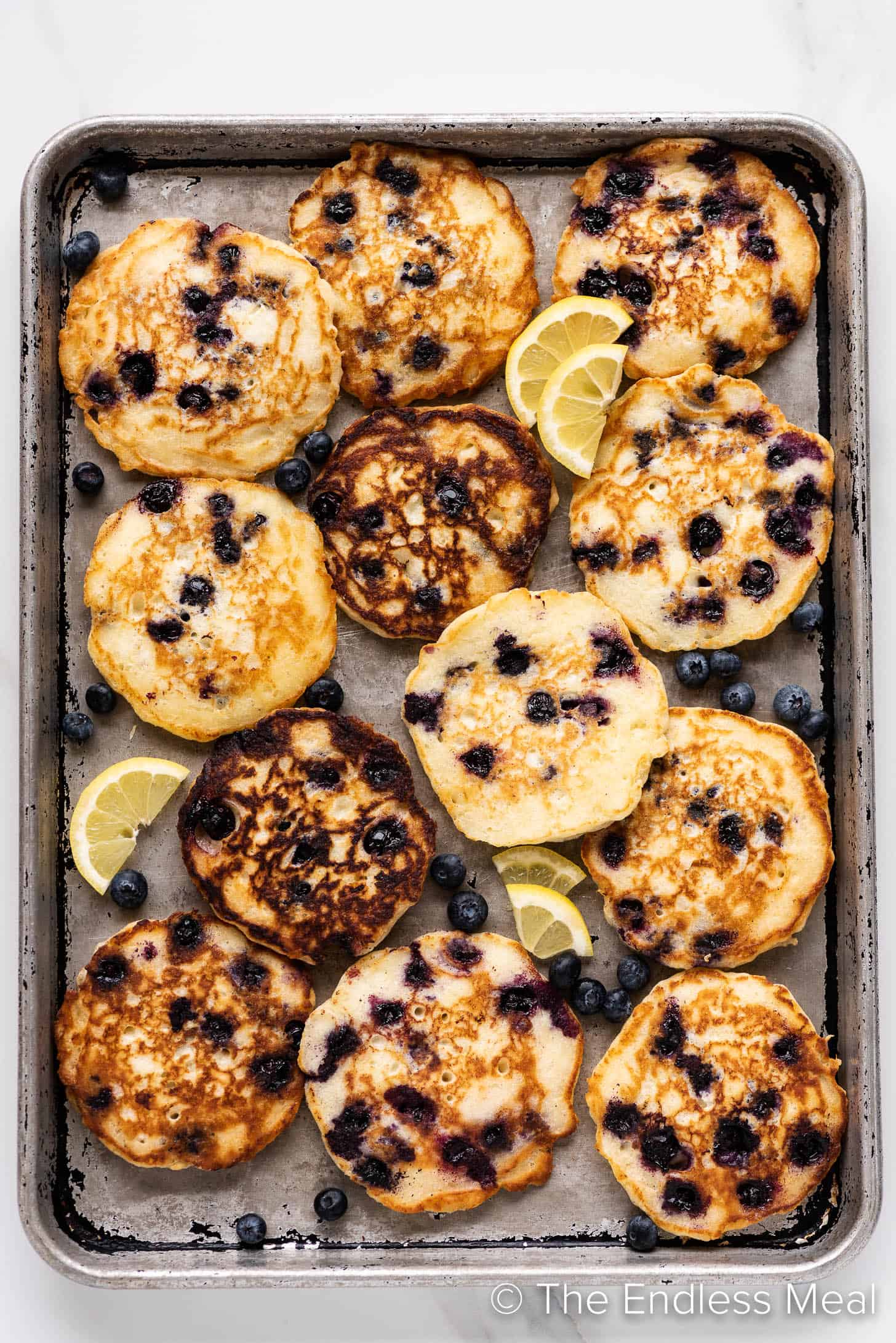 Lemon Blueberry Pancakes on a baking sheet.
