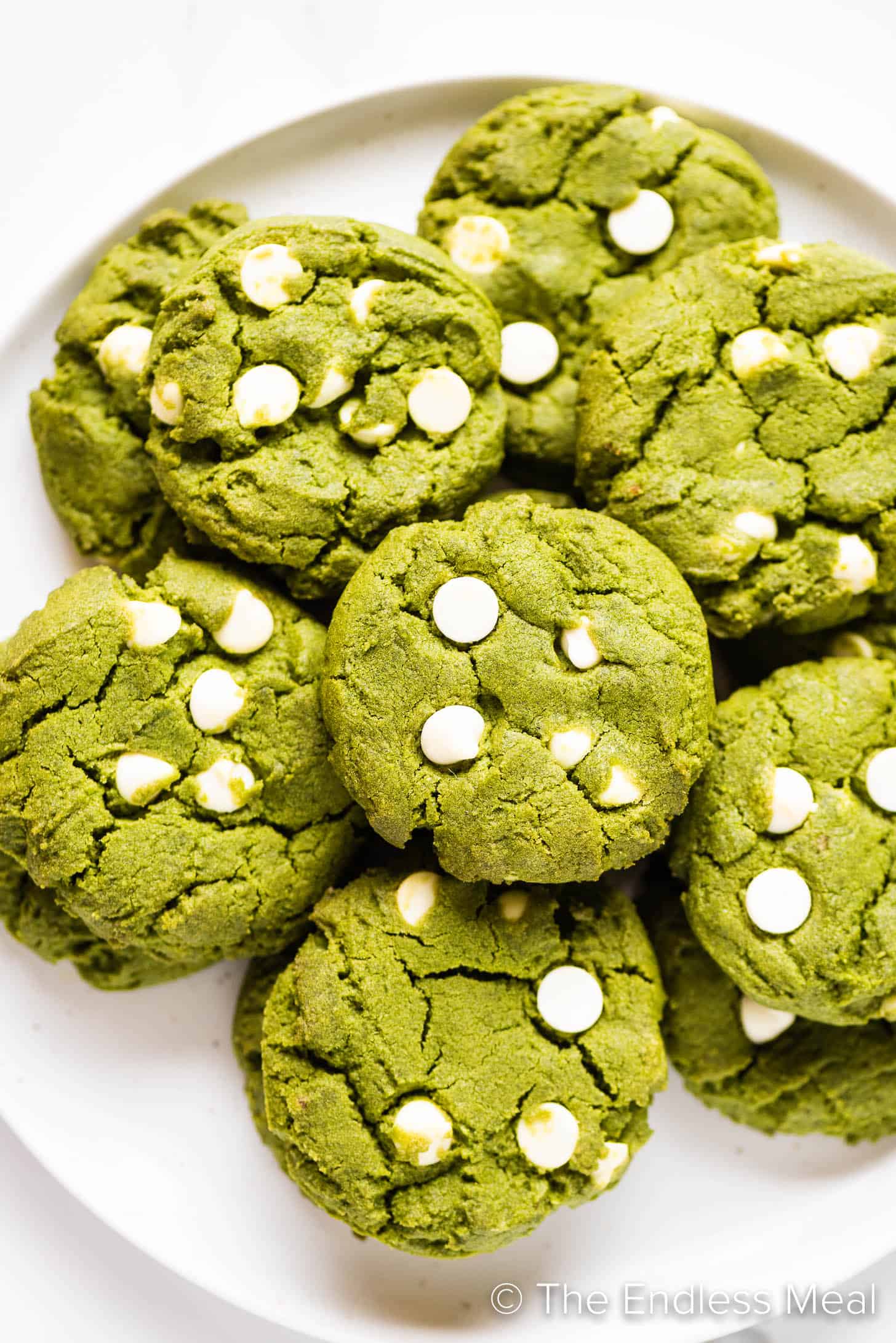 a plate piled high with green tea cookies