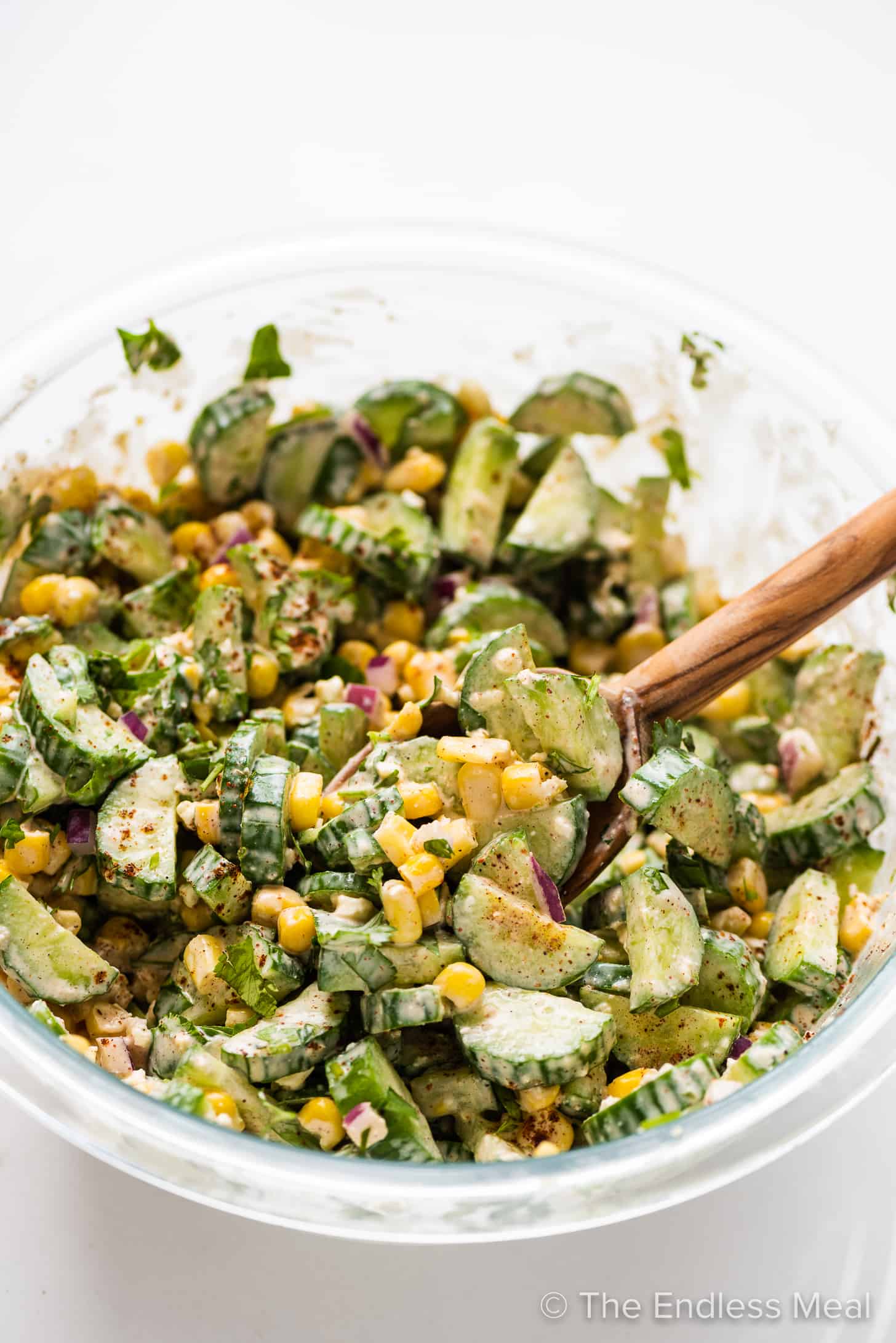 Mexican Cucumber corn Salad in a glass serving bowl