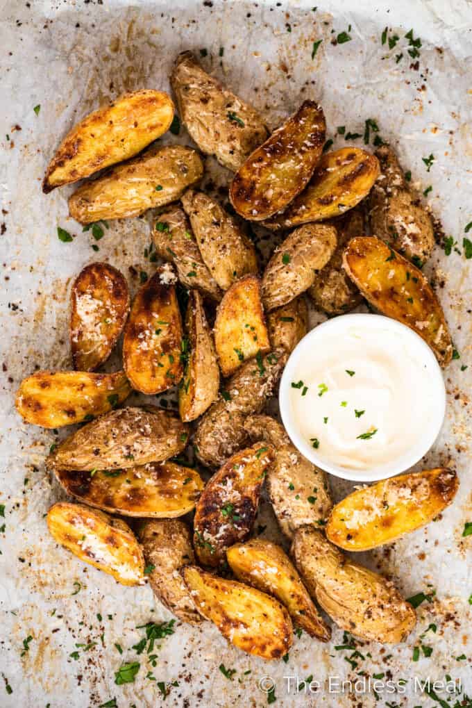 Roasted Fingerling Potatoes in a pile with a side of mayo