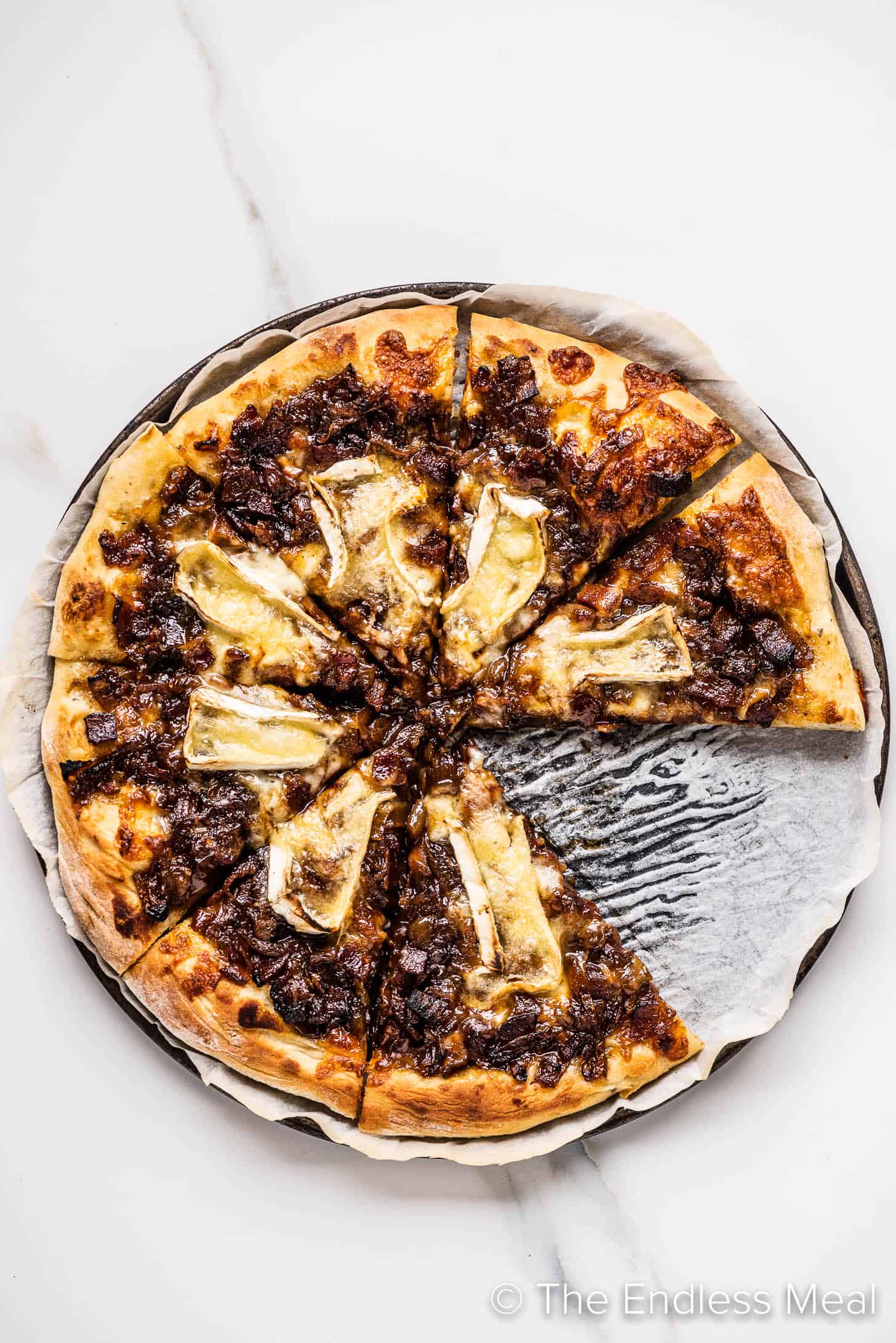 Bacon Jam Pizza with a slice removed