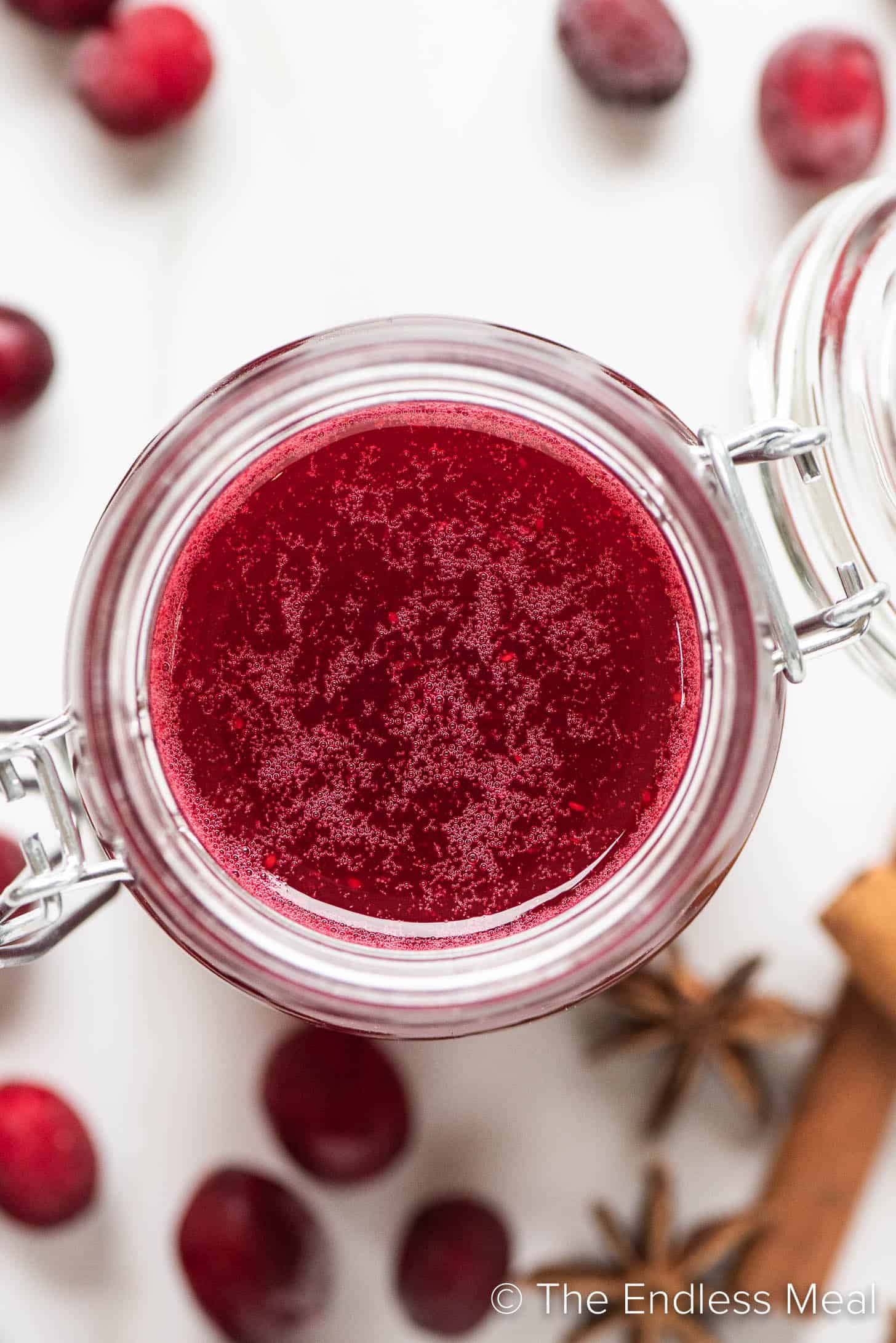 looking down on a glass jar filled with Cranberry Simple Syrup