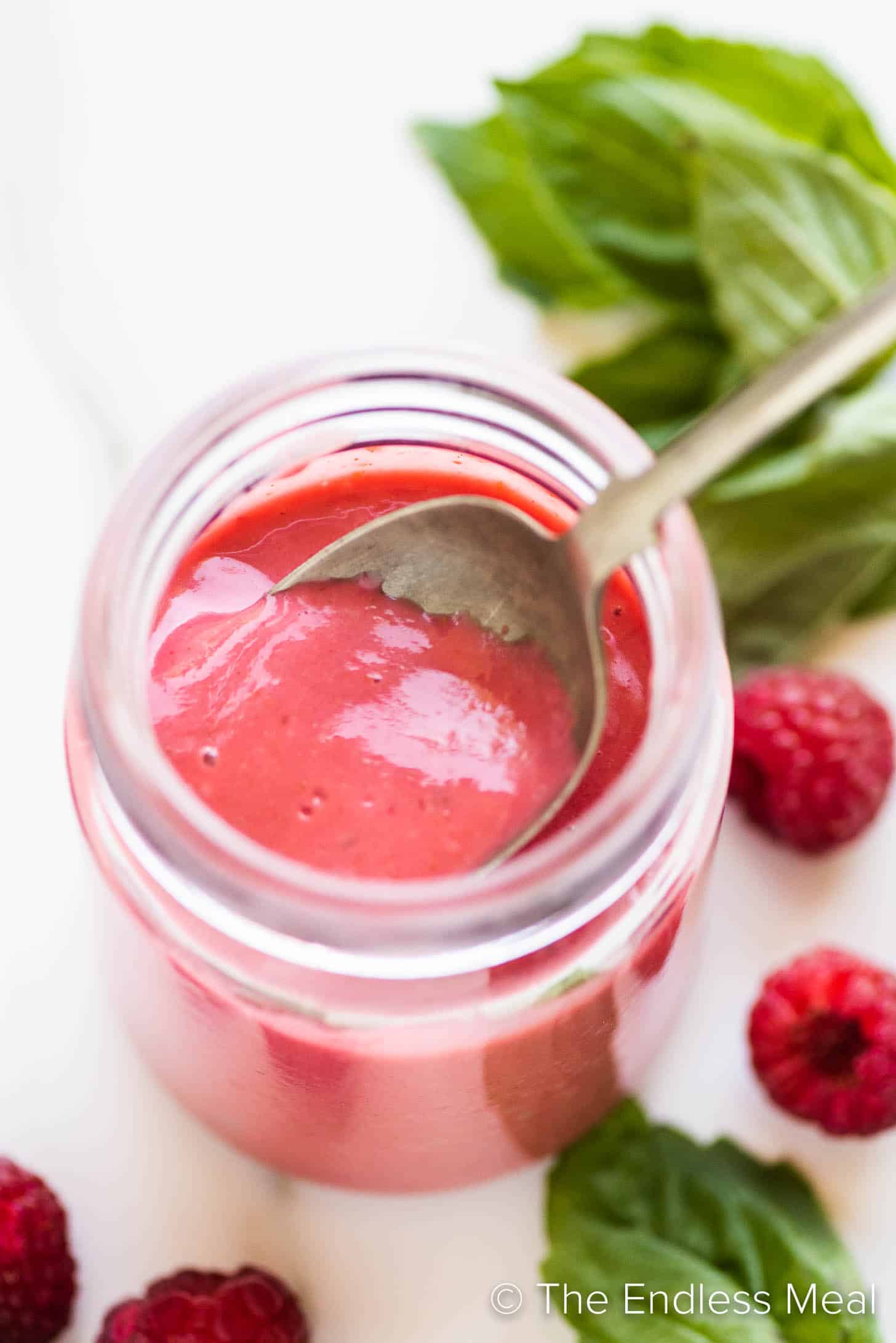 a vinaigrette with raspberries in a jar