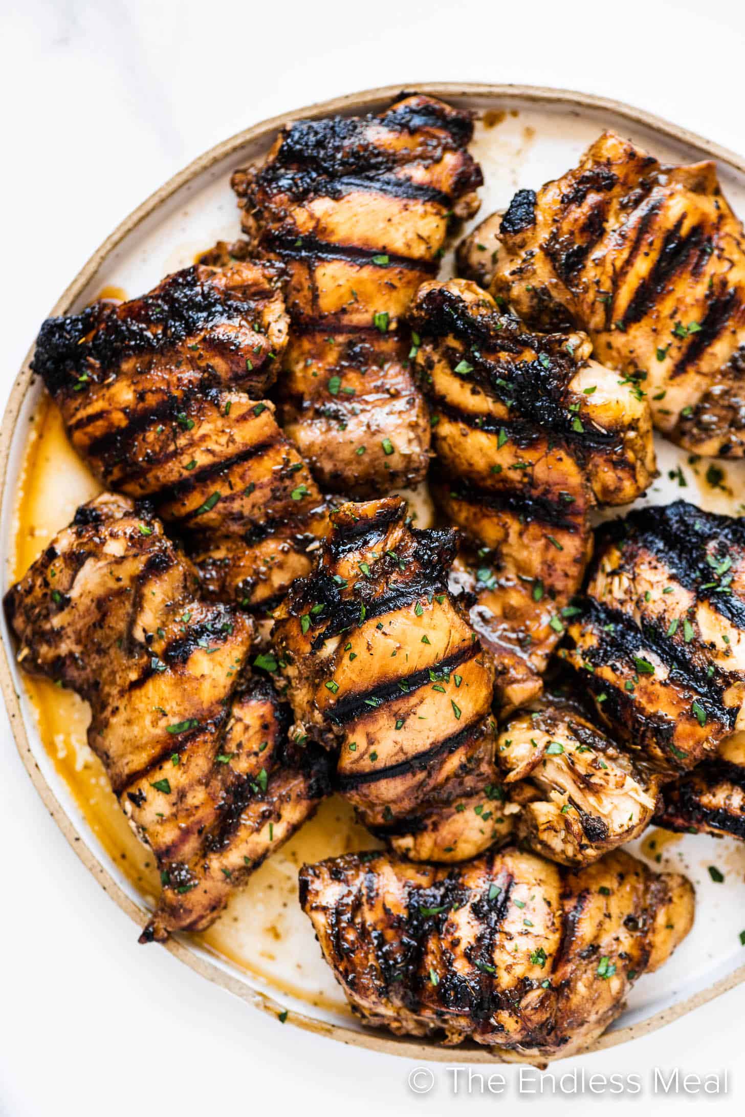 a close up of chicken marinated in balsamic chicken marinade on a plate.