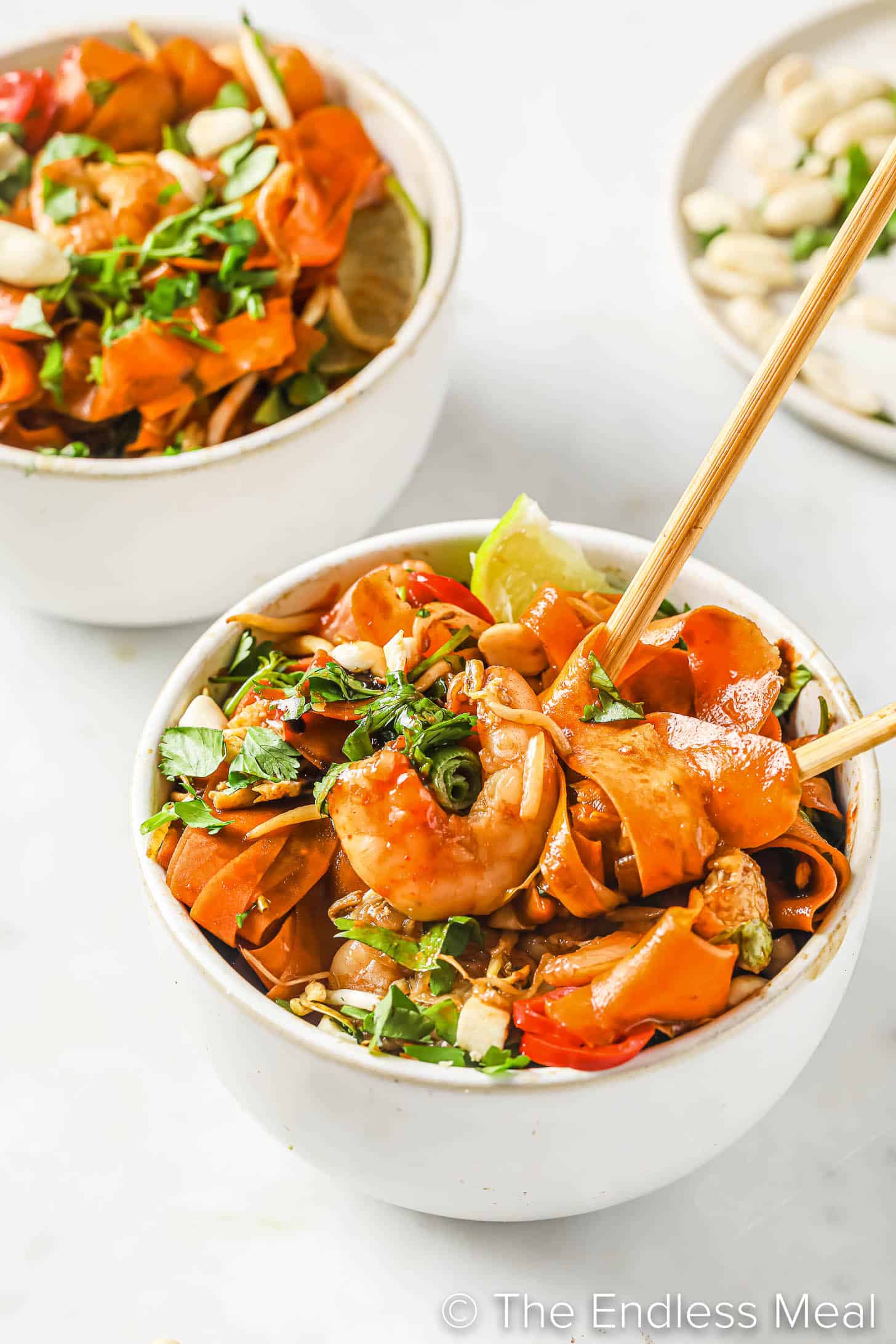 Carrot Noodle Pad Thai in a bowl with chopsticks