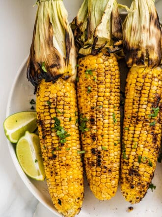 a plate of Grilled Corn on the Cob with Chili Lime Butter