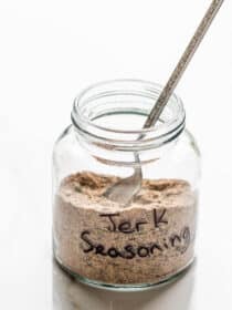 a glass jar labeled jerk seasoning