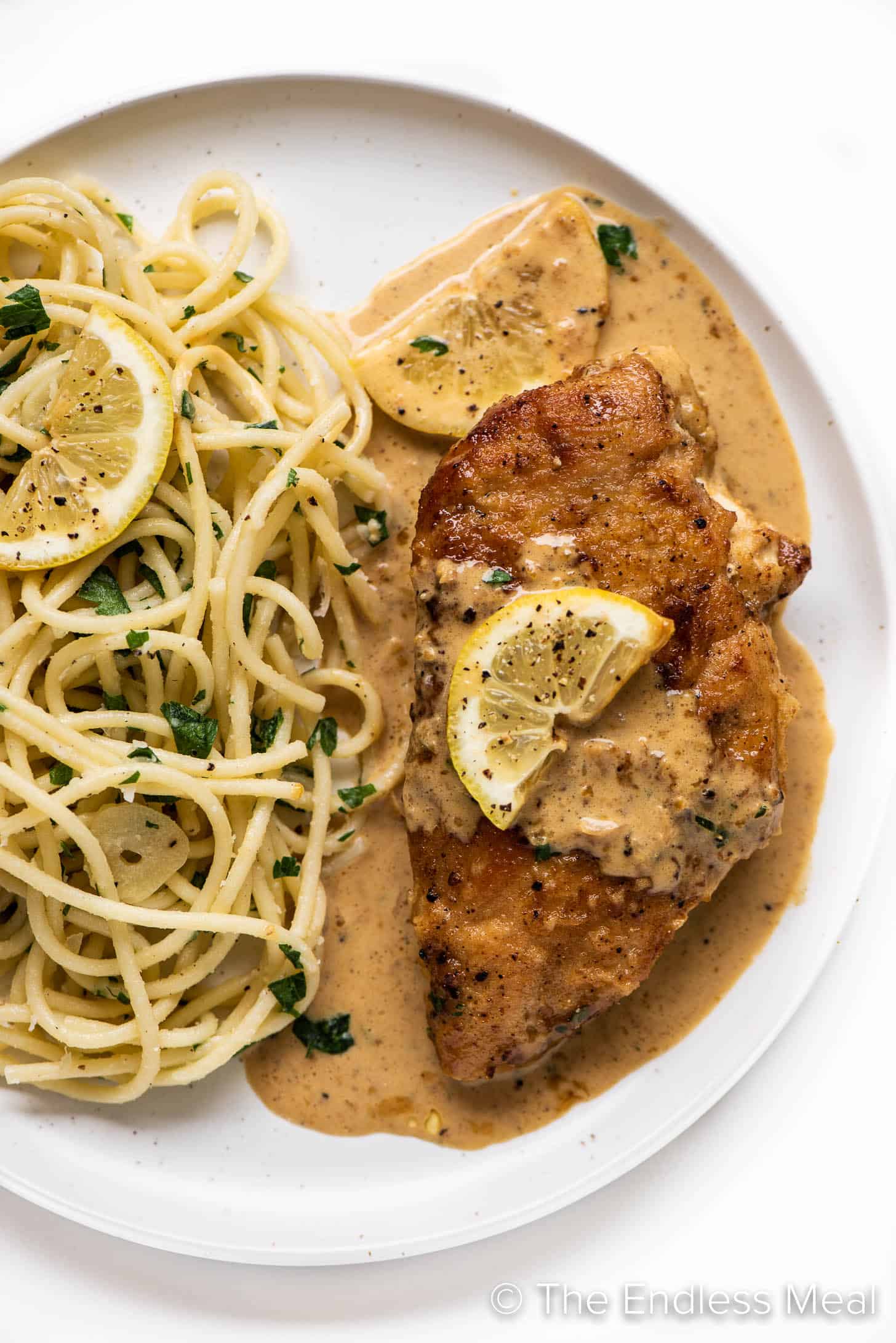 Lemon Pepper Chicken on a plate with pasta