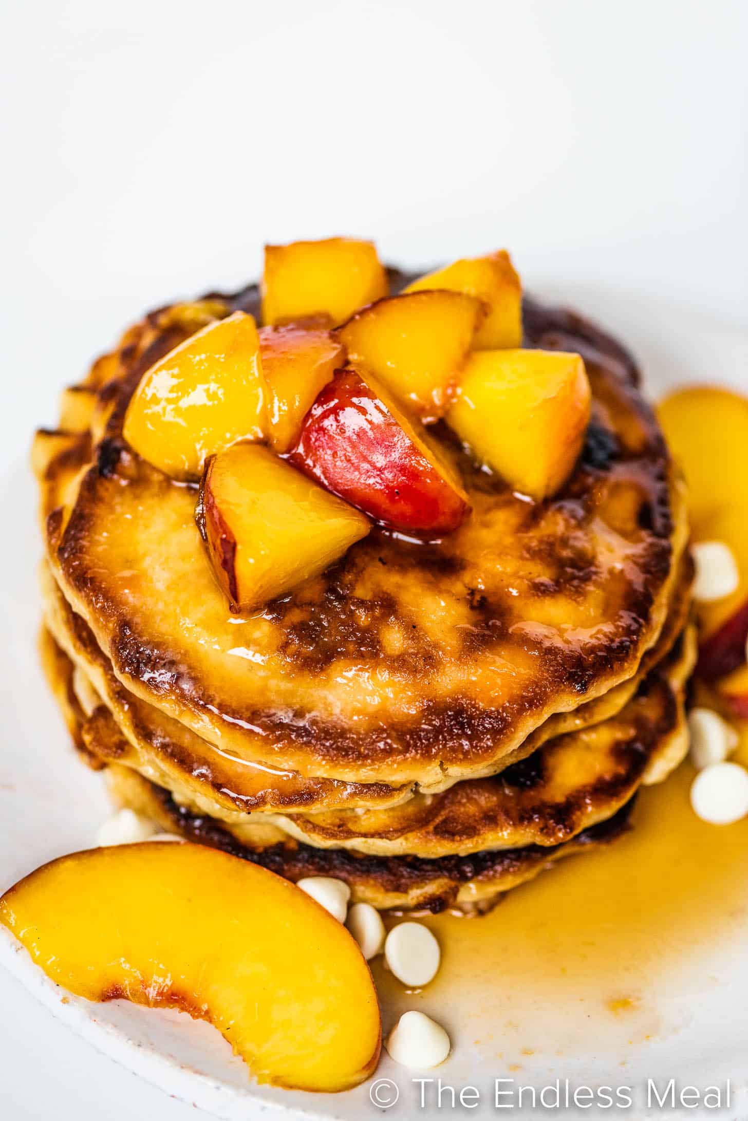 pancakes with peaches on a plate