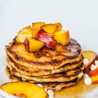 a tall stack of Peach Pancakes